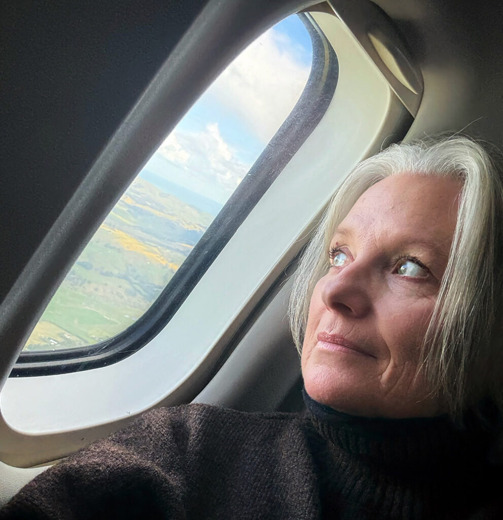 Megan looking out plane window